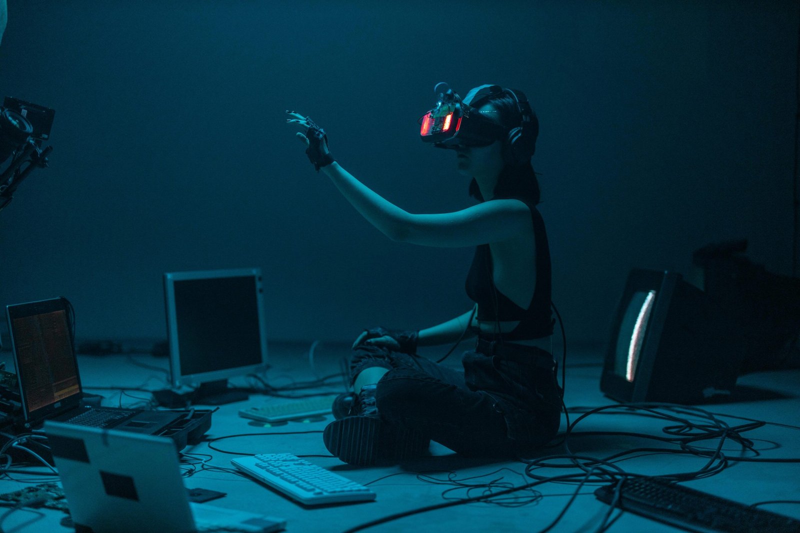 Person using virtual reality headset in a tech-driven environment.